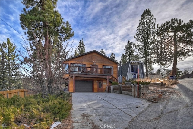 view of front of home featuring a garage and a deck