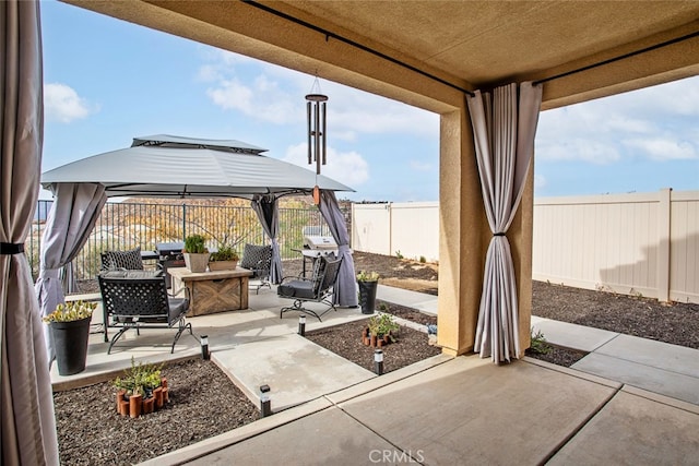 view of patio / terrace with a gazebo and an outdoor fire pit