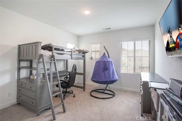 bedroom with light colored carpet