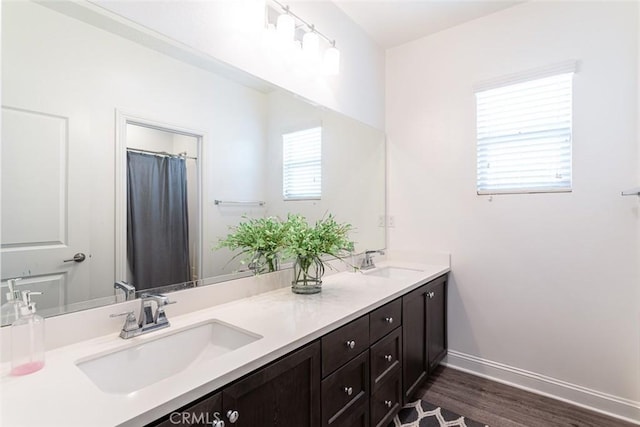 bathroom featuring vanity and hardwood / wood-style flooring