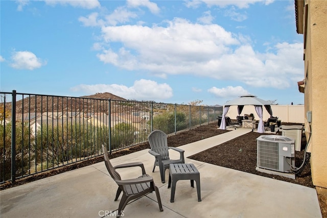 view of patio featuring a gazebo and central air condition unit