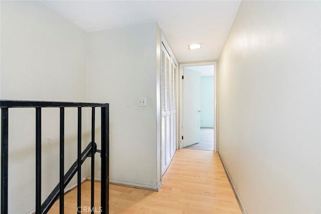 hallway with light wood-type flooring