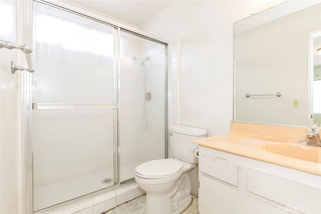 bathroom with vanity, an enclosed shower, and toilet