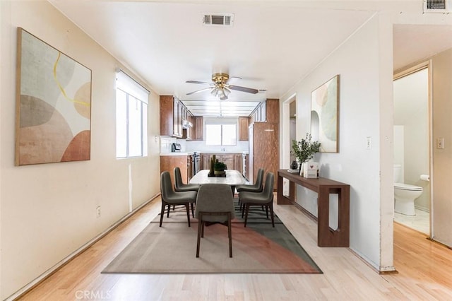 dining space featuring light hardwood / wood-style floors and ceiling fan