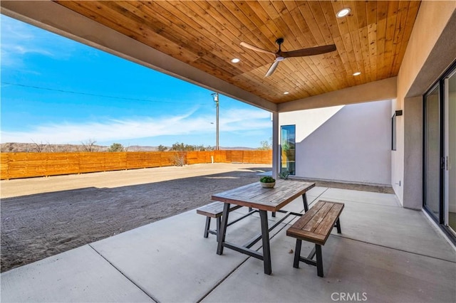 view of patio featuring ceiling fan