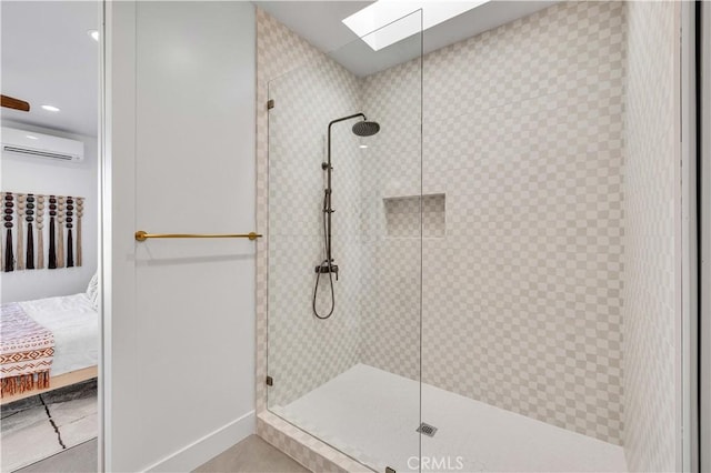 bathroom with a wall unit AC and a tile shower