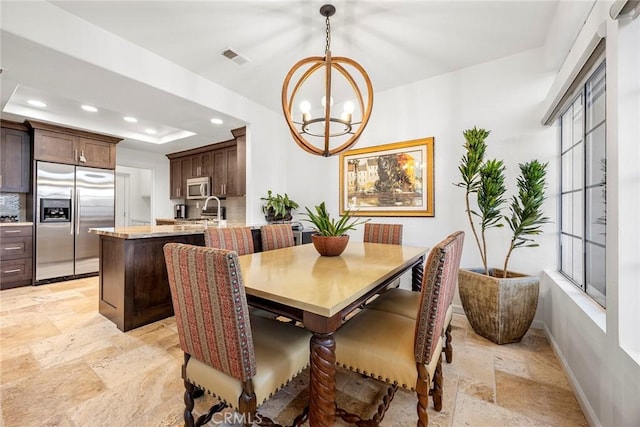 230 Shorebreaker Dr, Laguna Niguel, CA 92677 - dining room with a raised ceiling and a notable chandelier