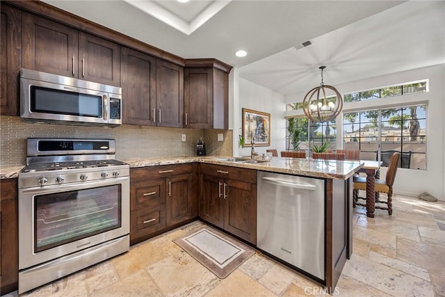 230 Shorebreaker Dr, Laguna Niguel, CA 92677 - kitchen with stainless steel appliances, light stone countertops, sink, and kitchen peninsula