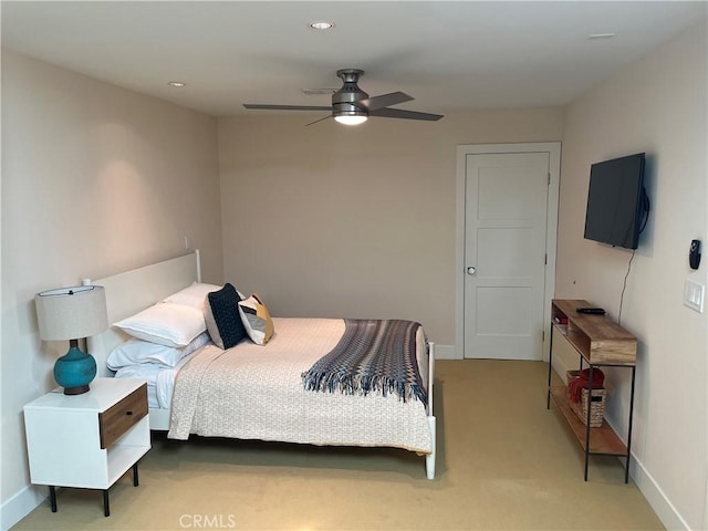 carpeted bedroom featuring ceiling fan