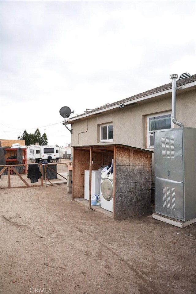 back of property featuring washer / dryer