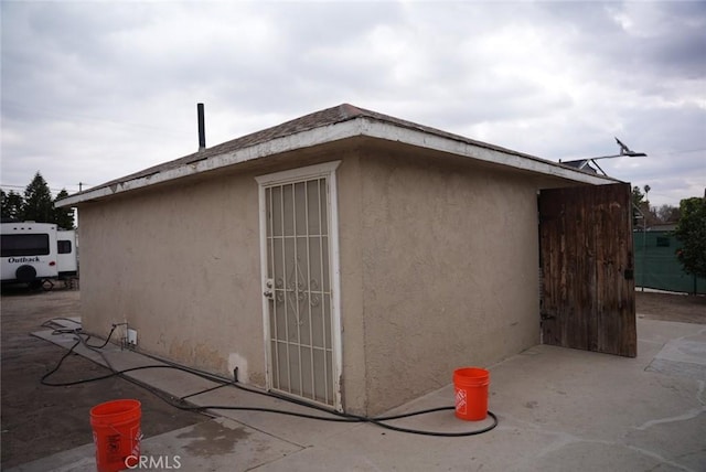 view of property exterior featuring a patio area