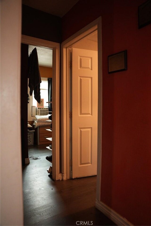 hallway with wood-type flooring