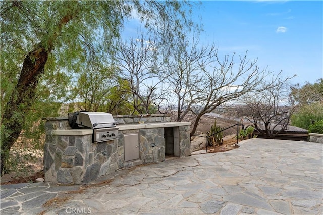 view of patio featuring grilling area and exterior kitchen