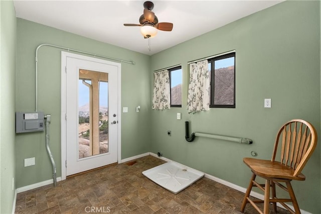 doorway to outside with ceiling fan