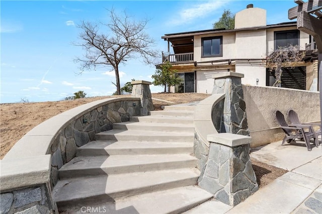 surrounding community featuring a patio area