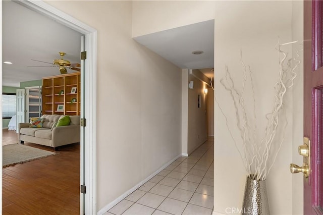 hall with light tile patterned flooring