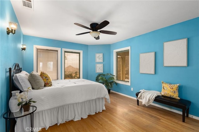 bedroom featuring ceiling fan and light hardwood / wood-style floors