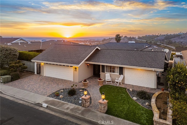 single story home with a garage