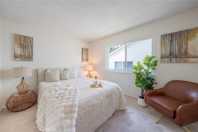 bedroom featuring carpet floors and a textured ceiling