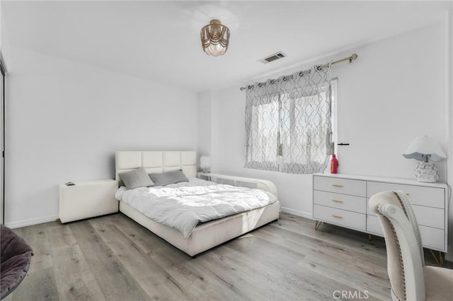 bedroom with light wood-type flooring