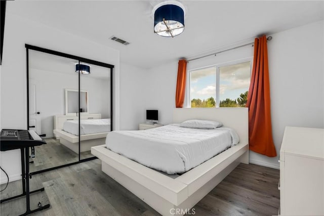 bedroom with hardwood / wood-style floors