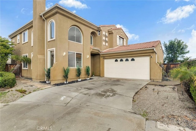 mediterranean / spanish-style house featuring a garage