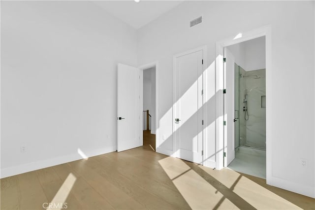 2319 Huntington Ln Unit A, Redondo Beach, CA 90278 - unfurnished bedroom with wood finished floors and ensuite bathroom