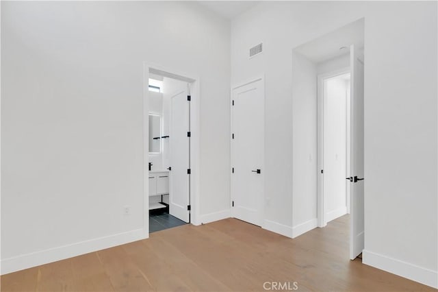 2319 Huntington Ln Unit A, Redondo Beach, CA 90278 - unfurnished bedroom with wood finished floors and ensuite bath