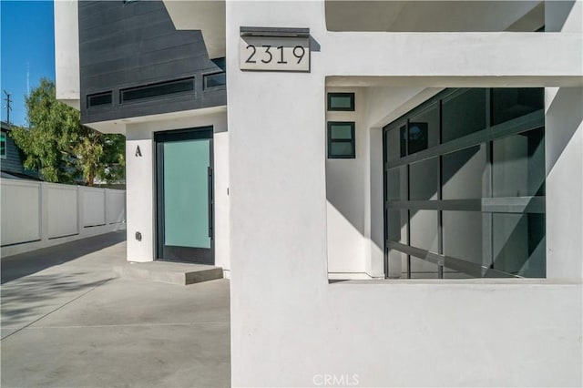 2319 Huntington Ln Unit A, Redondo Beach, CA 90278 - doorway to property with stucco siding