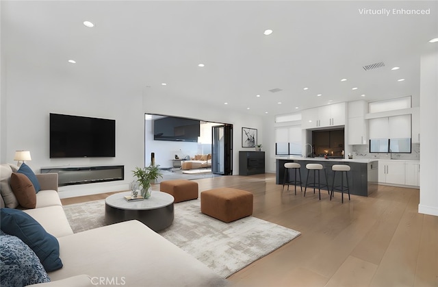 2319 Huntington Ln Unit A, Redondo Beach, CA 90278 - living room with light wood finished floors and recessed lighting
