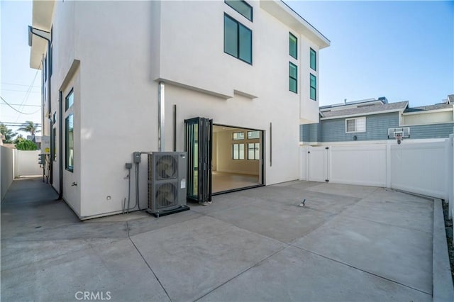 2319 Huntington Ln Unit A, Redondo Beach, CA 90278 - back of property featuring a patio area, stucco siding, a fenced backyard, and a gate
