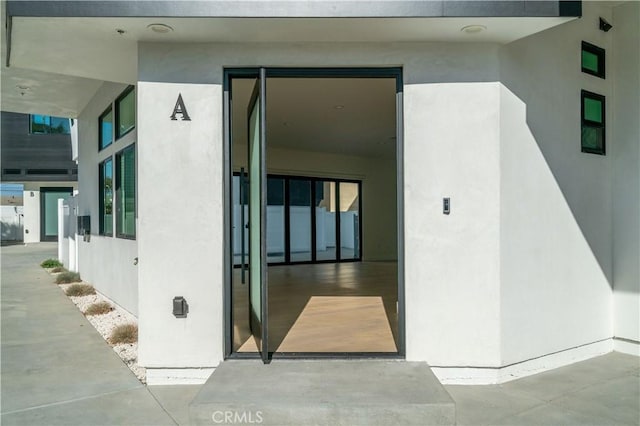 2319 Huntington Ln Unit A, Redondo Beach, CA 90278 - doorway to property with stucco siding
