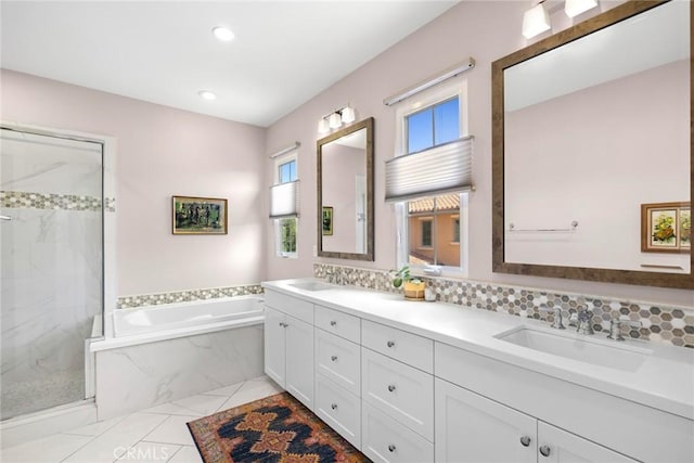 bathroom featuring vanity and plus walk in shower