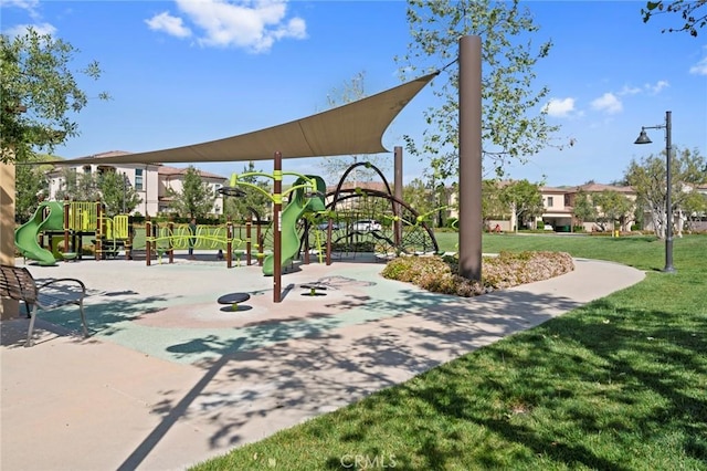 view of property's community with a yard and a playground