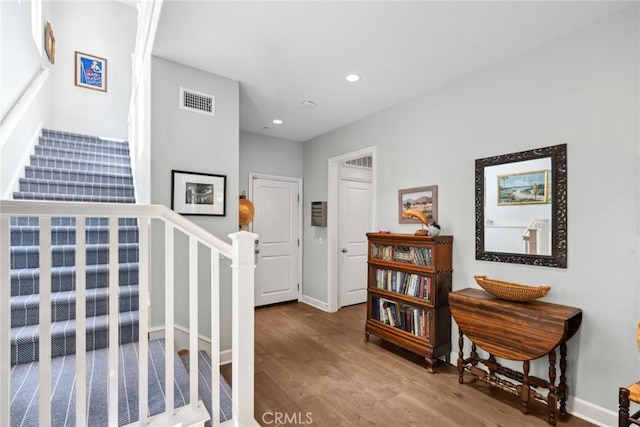 corridor featuring hardwood / wood-style floors