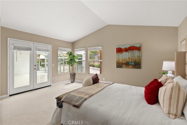 carpeted bedroom with access to exterior, vaulted ceiling, and french doors