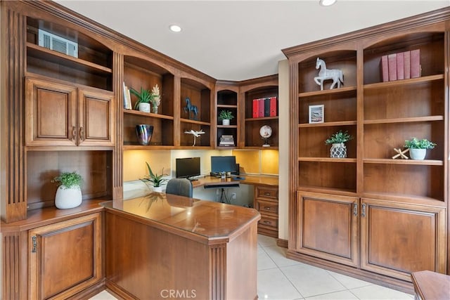 office area with built in desk and light tile patterned flooring