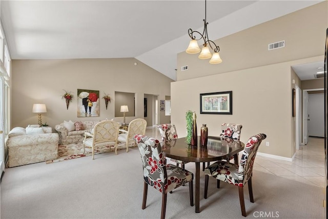 tiled dining area with high vaulted ceiling