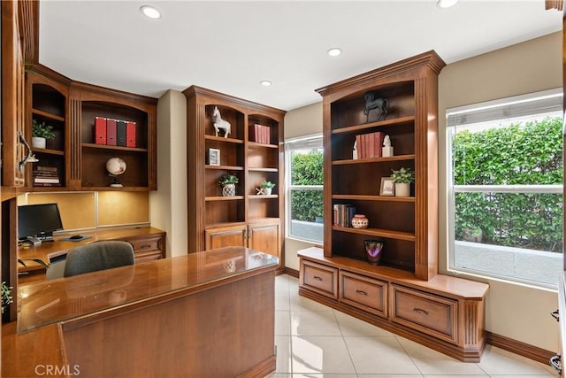 tiled office space featuring built in desk