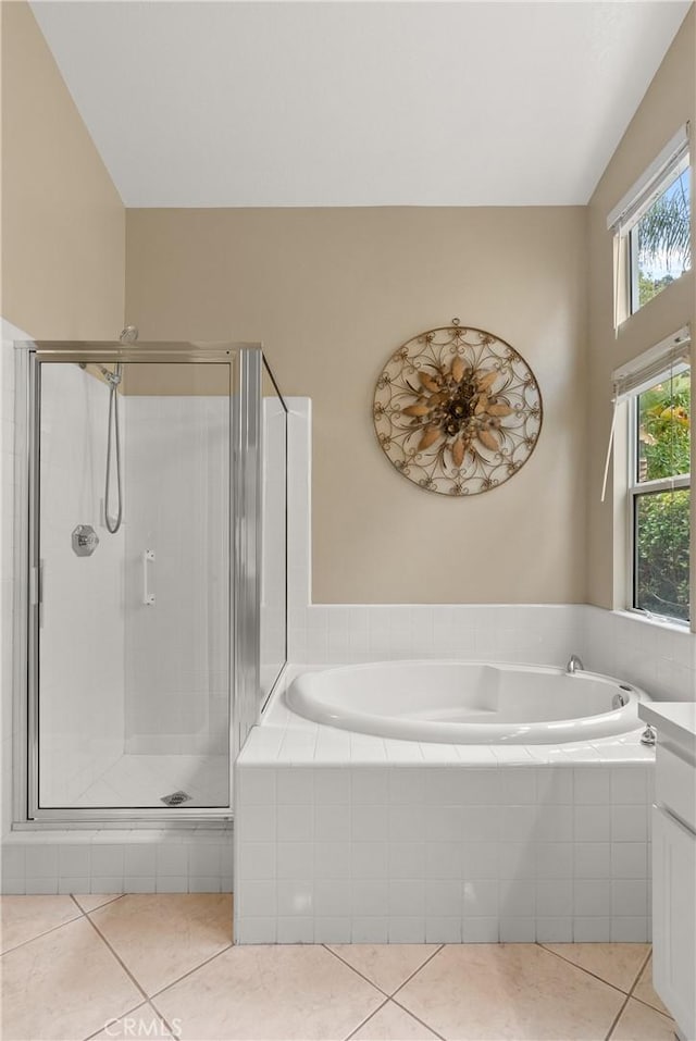 bathroom with vanity, separate shower and tub, and tile patterned flooring