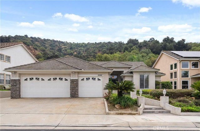 view of front of home featuring a garage