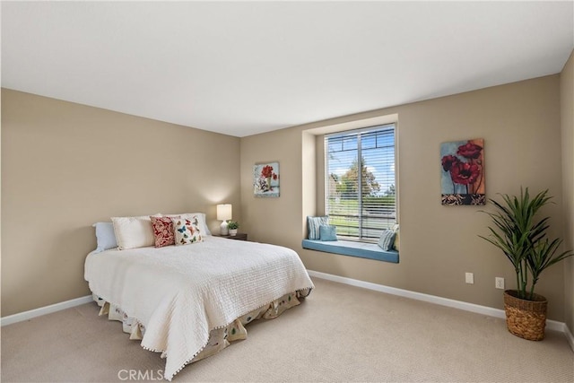 bedroom with light colored carpet