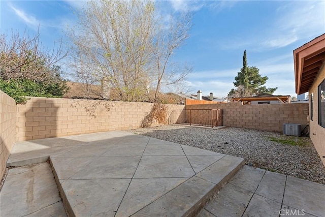 view of patio / terrace featuring central air condition unit and a fenced backyard