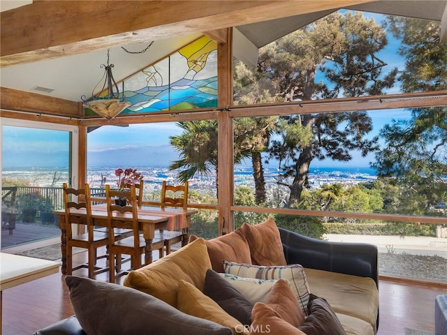 sunroom / solarium with a water view