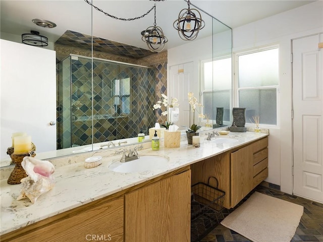 bathroom featuring vanity and a shower with shower door