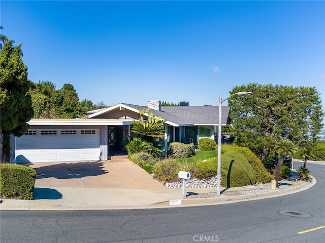 single story home featuring a garage