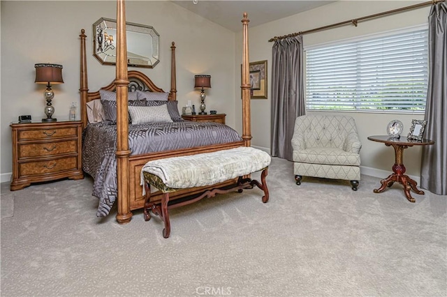 bedroom with light carpet and baseboards