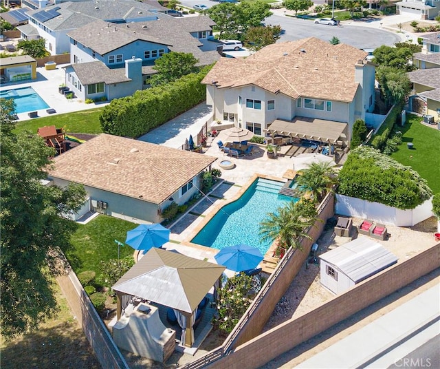 birds eye view of property with a residential view