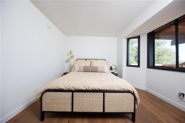 bedroom featuring dark hardwood / wood-style floors