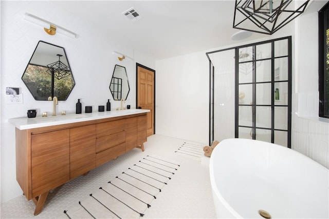 bathroom featuring vanity and a bathing tub